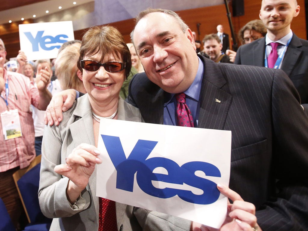 Salmond poses with a supporter in Perth yesterday