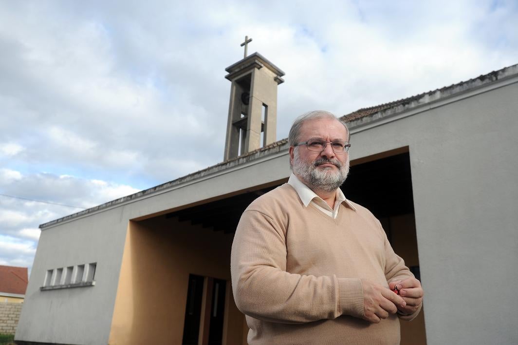 Rev Alain Krauth outside Saint-Eloi's church