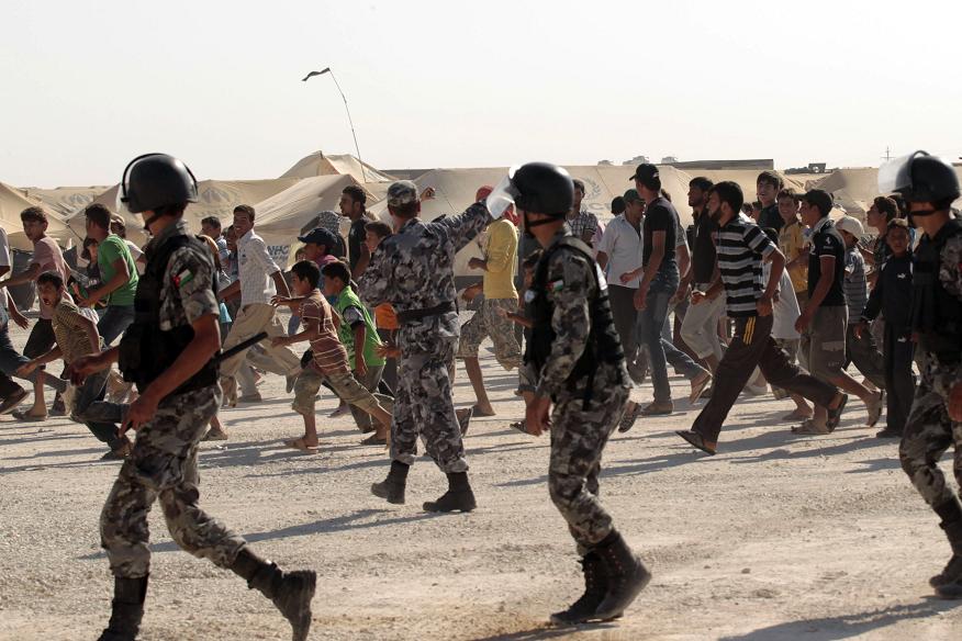 Syrian refugees at the at Zaatri refugee camp, close to the northern Jordanian city of Mafraq, and home to some 30,000 Syrians fleeing the violence in their own country