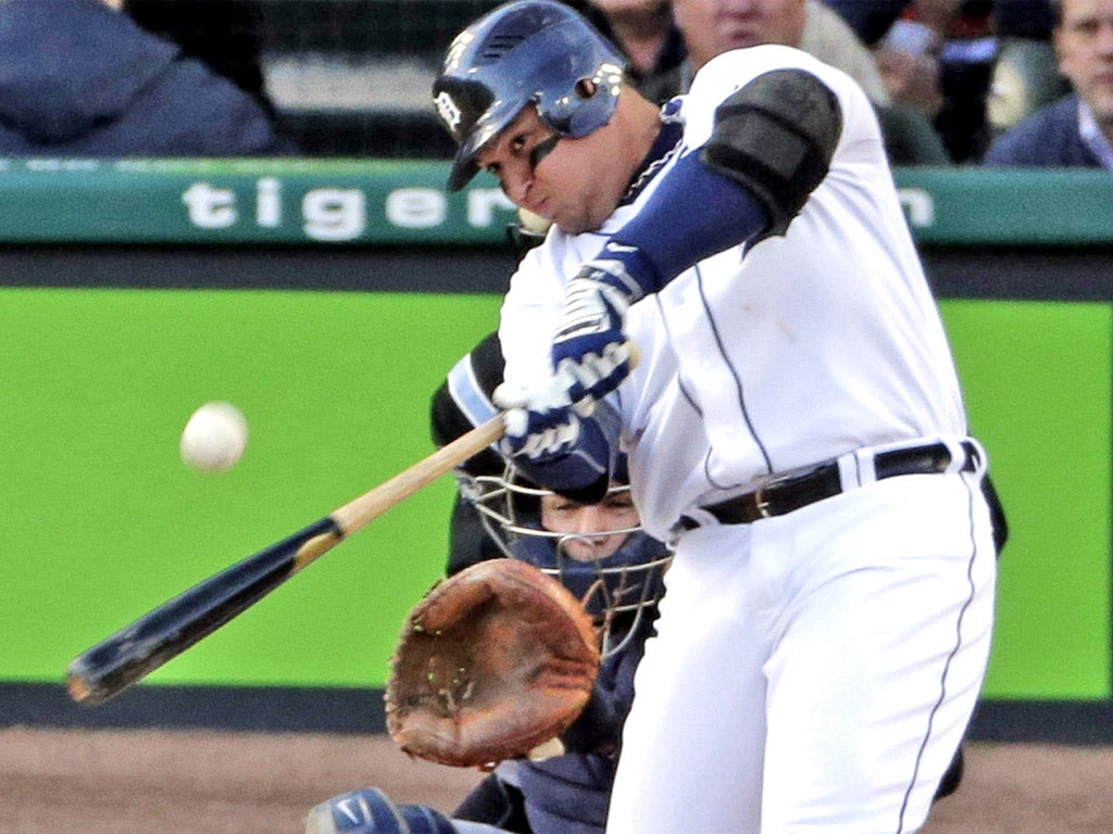 Tigers' Miguel Cabrera hits a home run against the Yankees