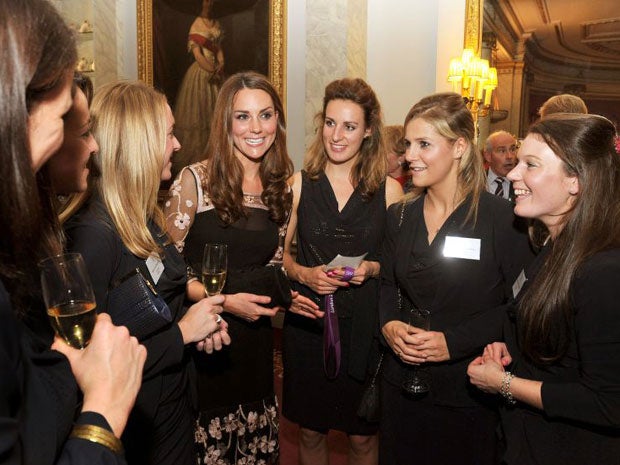 The Duchess of Cambridge talks to the women's hockey team during a reception held for the Team GB Olympic and Paralympic London 2012 medallists