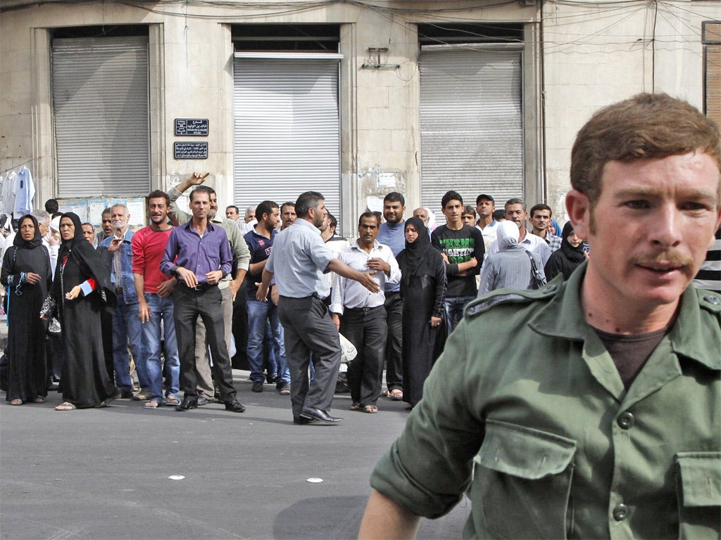 Relatives of Syrian detainees who were arrested over protests against President Bashar al-Assad's government in Damascus