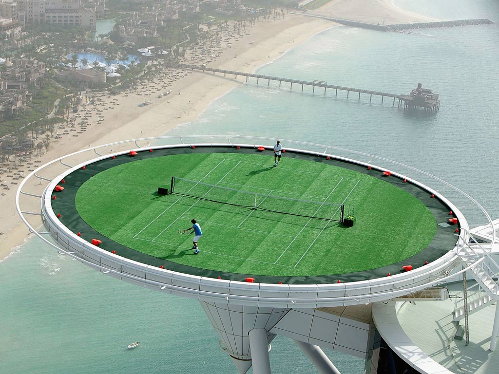 <b>Tennis on the Burj Al Arab</b><br/>
Promoting the 2005 Dubai Duty Free Men's Open, Roger Federer and Andre Agassi staged a game atop the Burj Al Arab luxury hotel. It was a bit of fun, but hard work for the ball boys and girls.