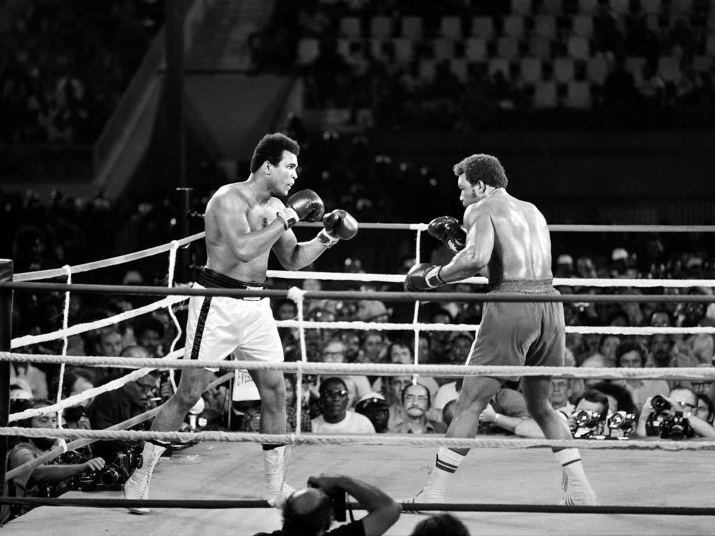 Muhammad Ali (left) and George Foreman squared off in a classic