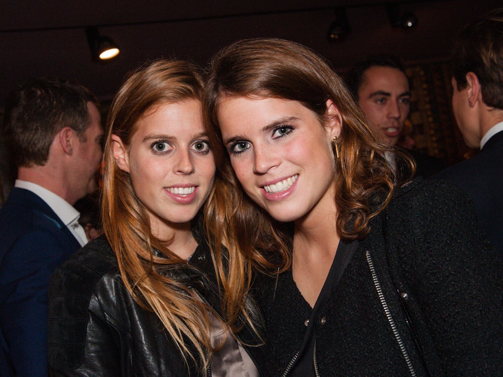 Princesses Beatrice and Eugenie at the Aston Martin private preview in 2012