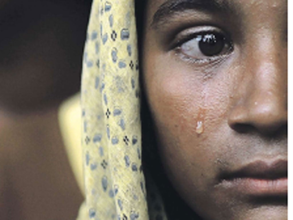 Trauma is etched on the face of a young Burmese Muslim as she
arrives at a refugee camp in the wake of violence in Rakhine state
which victims are describing as “ethnic cleansing”
