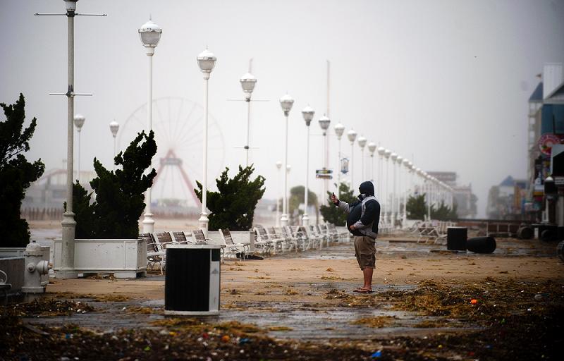 A man takes a photo of the storm in Maryland