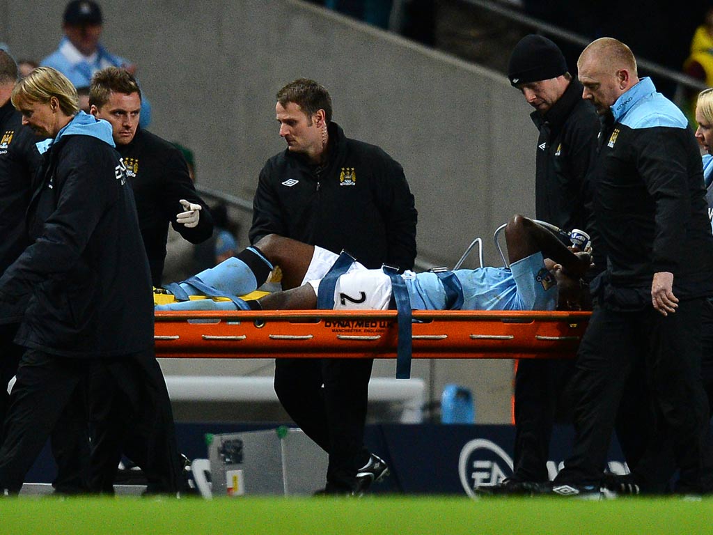 Micah Richards is taken off in the Premier League game against Swansea