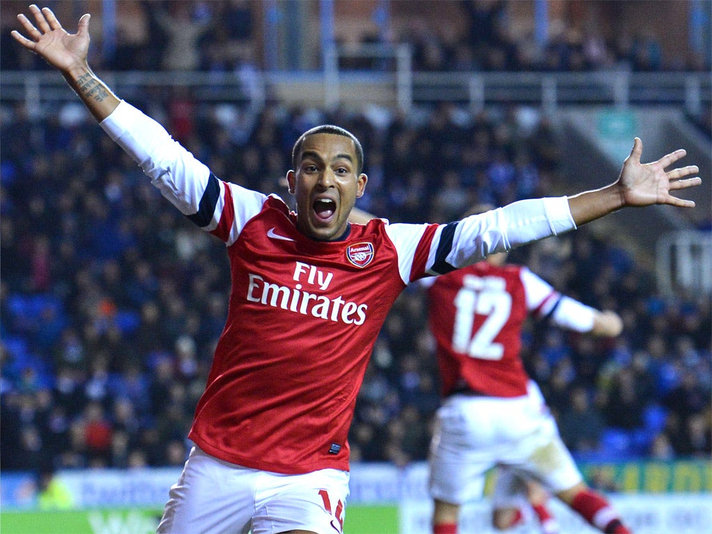 Arsenal's Theo Walcott celebrates scoring against Reading last night