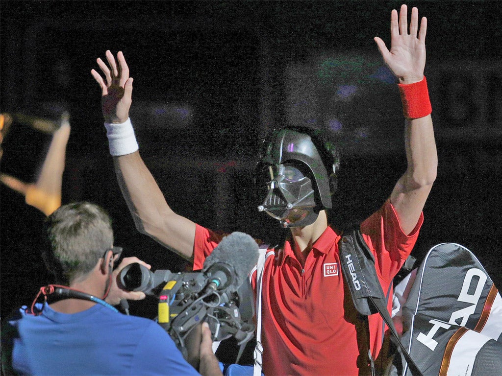 Serbia’s Novak Djokovic sports a Darth Vader mask before his shock first-round exit to the American Sam Querrey yesterday