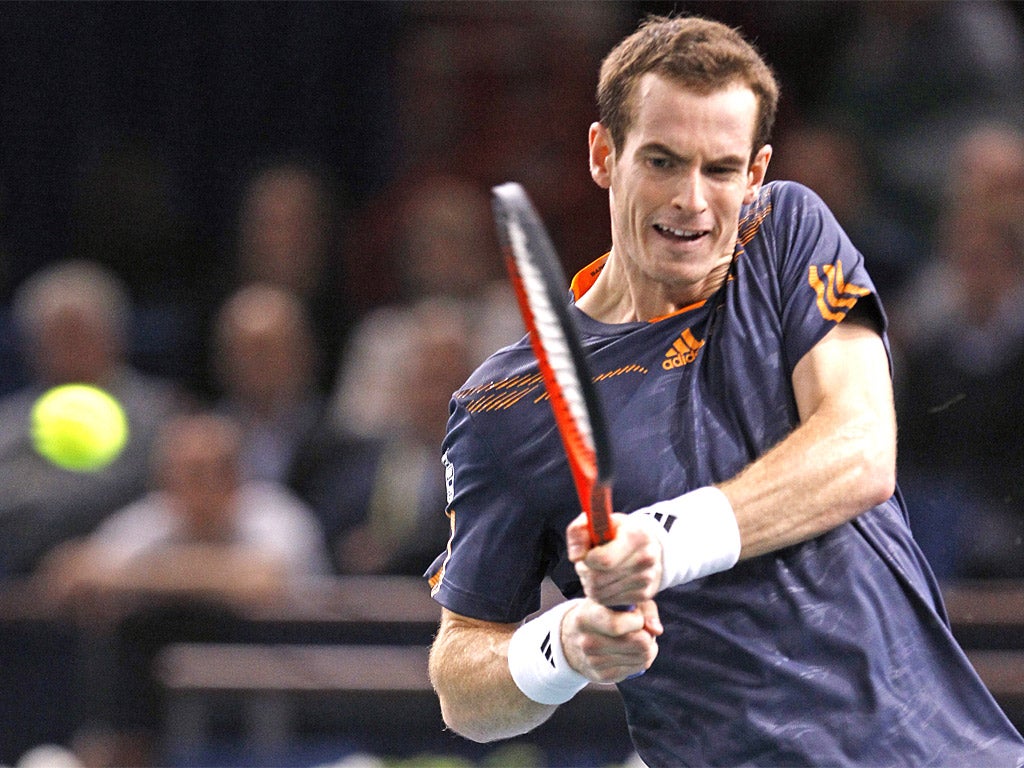 Andy Murray hits a backhand return