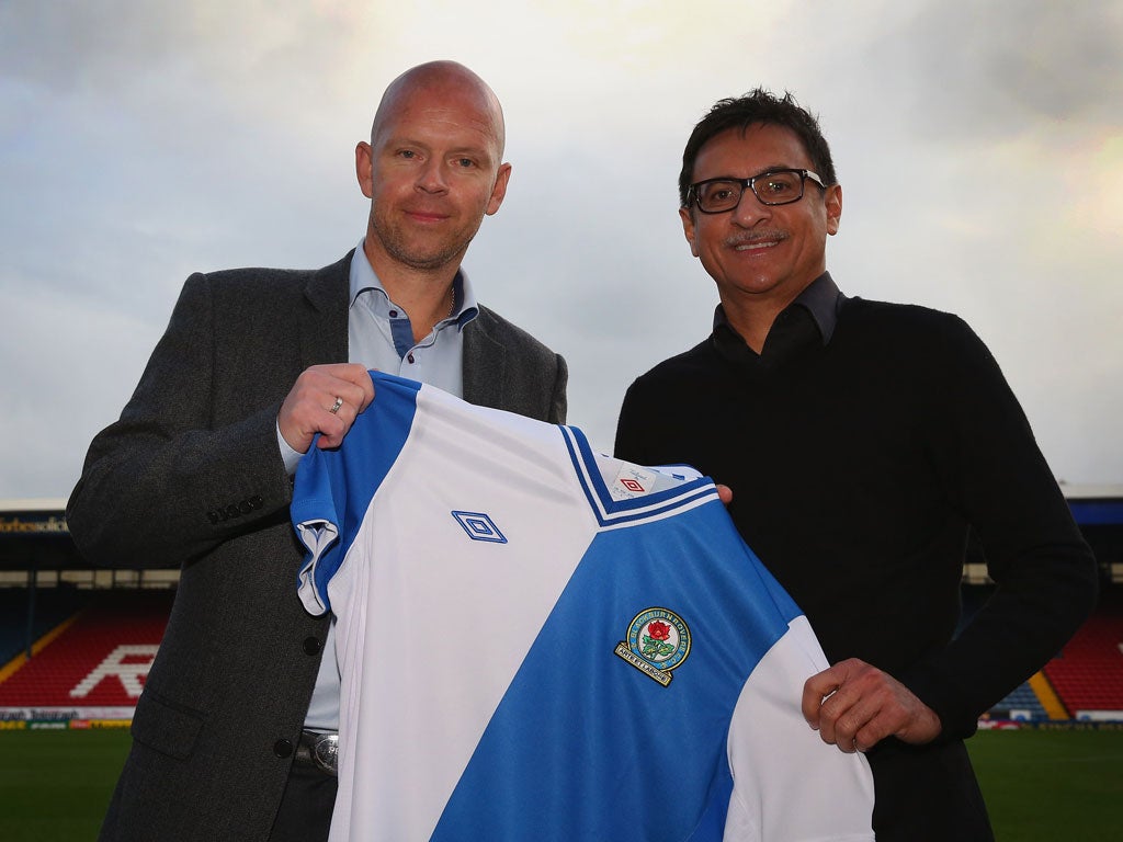 Henning Berg alongside Shebby Singh at Ewood Park yesterday