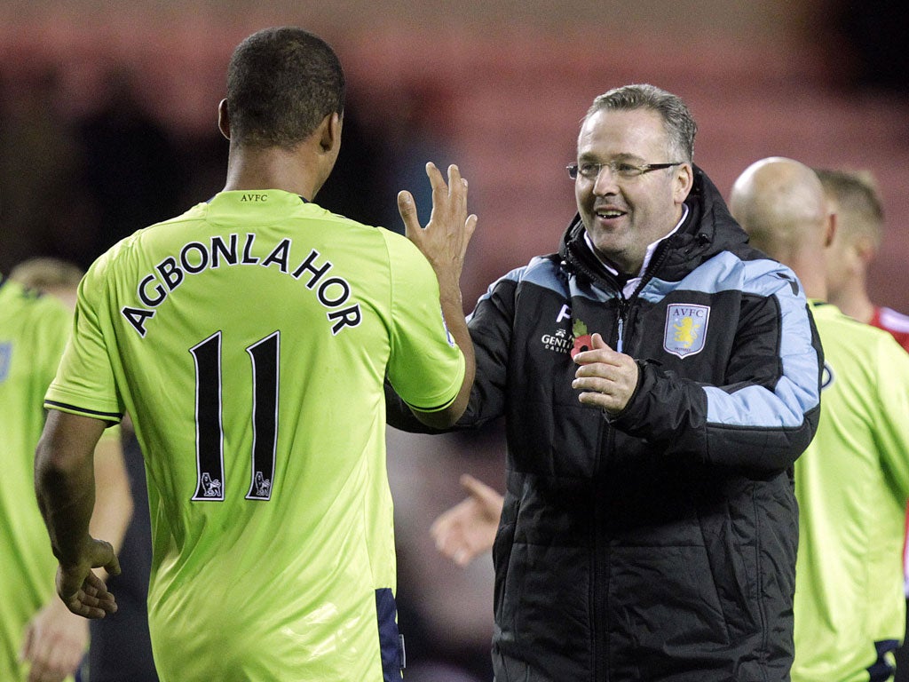 Agbonlahor celebrates with his manager, Paul Lambert