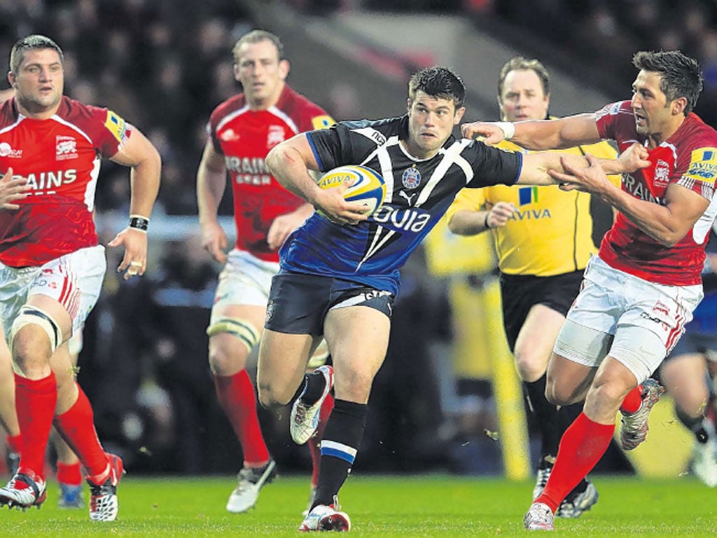 Guy Mercer of Bath is tackled by London Welsh’s Gavin Henson