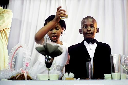 Children toast at a 2005 wedding reception in Soweto