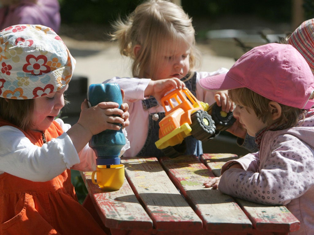 German toddlers of the 'Frogs' group play in the garden at the Spreekita Kindergarten in Berlin 03 May 2007.