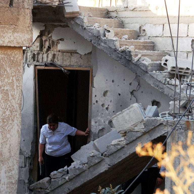 Some of the damage caused by the mortar attack in a residential district of Damascus