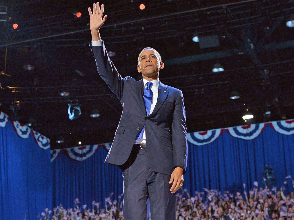 US President Barack Obama waves at supporters following his victory speech