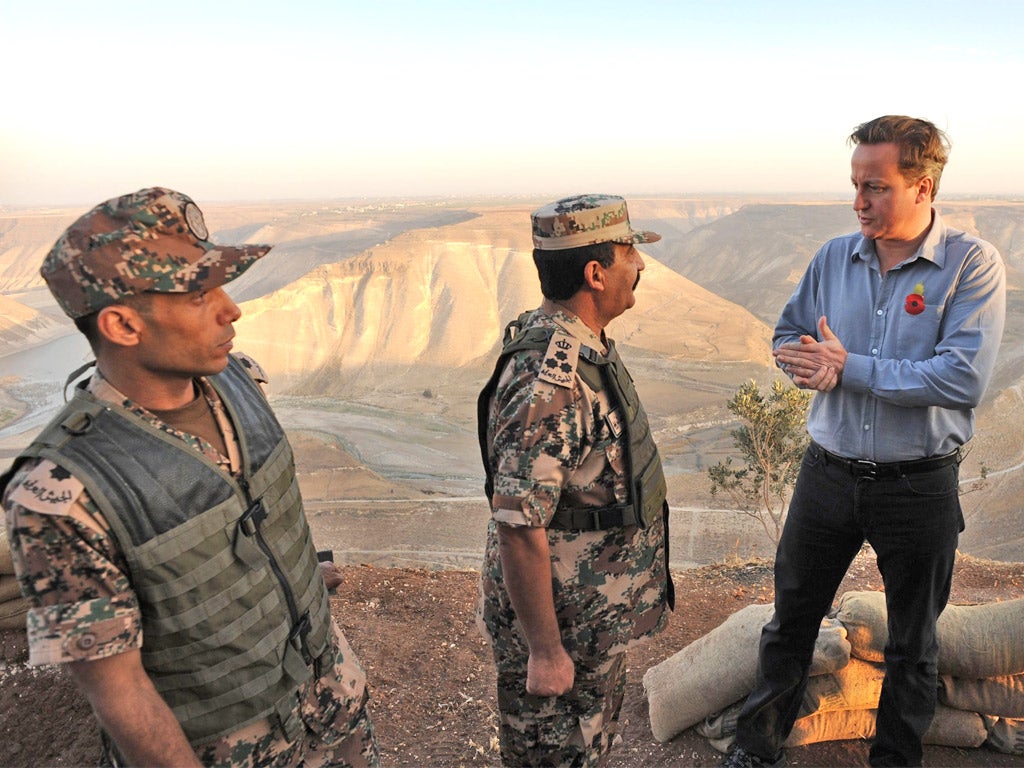 David Cameron talks to guards on Jordan’s border with Syria