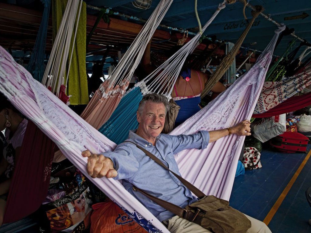 Michael Palin on a boat to Amazonia