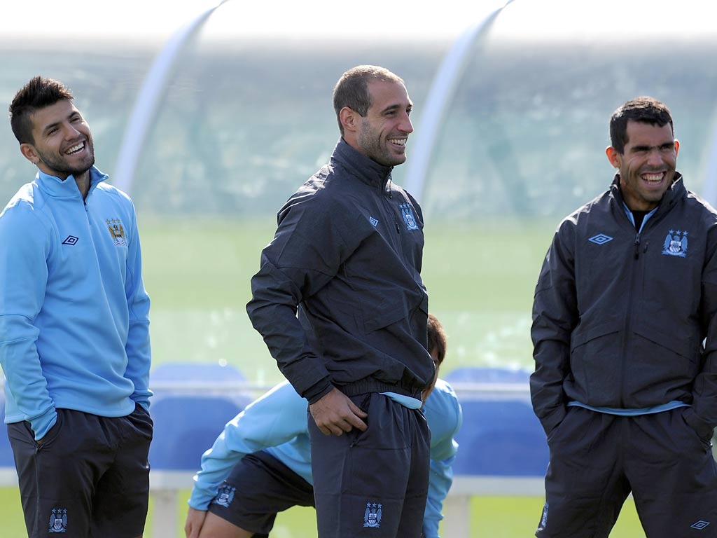 Sergio Aguero (L), Pablo Zabaleta (C) and Carlos Tevez