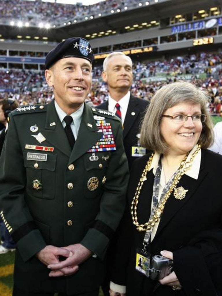 David Petraeus, seen with his wife Holly, said his extramarital affair was unacceptable conduct