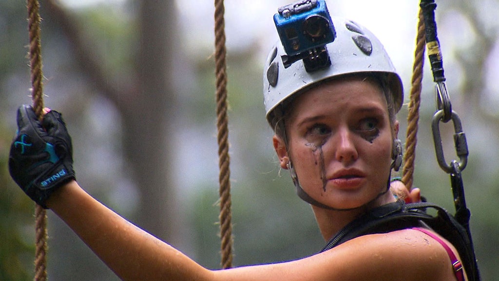 Helen Flanagan in the High Wire challenge. The tearful actress, who admitted to having a dislike of heights, found herself high above the rainforest perching precariously on the narrow wire, which she had to cross to the other side and into camp.