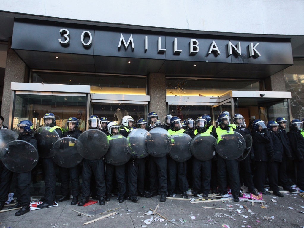 Police defend 30 Millbank, headquarters of the Conservative Party, against protesters two years ago