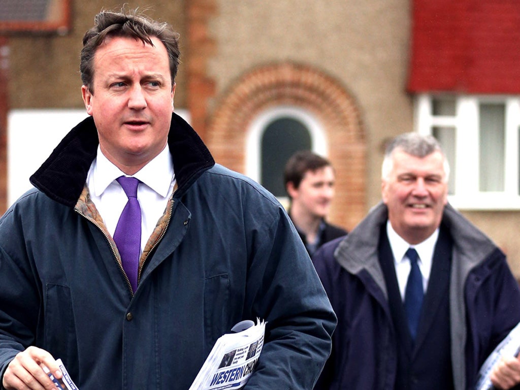 Prime Minister David Cameron (L) helps (R) Ken Maddock campaign for the Police and Crime Commissioner elections in Avon and Somerset