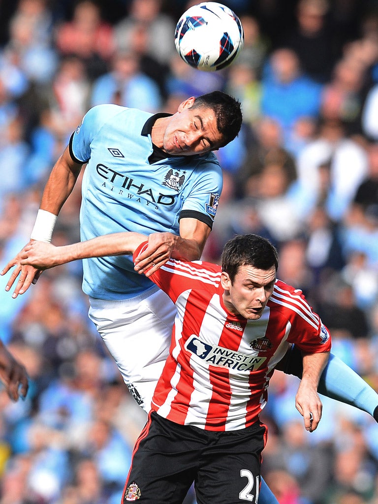 Aleksandar Kolarov wins a header against Sunderland's Adam Johnson last month