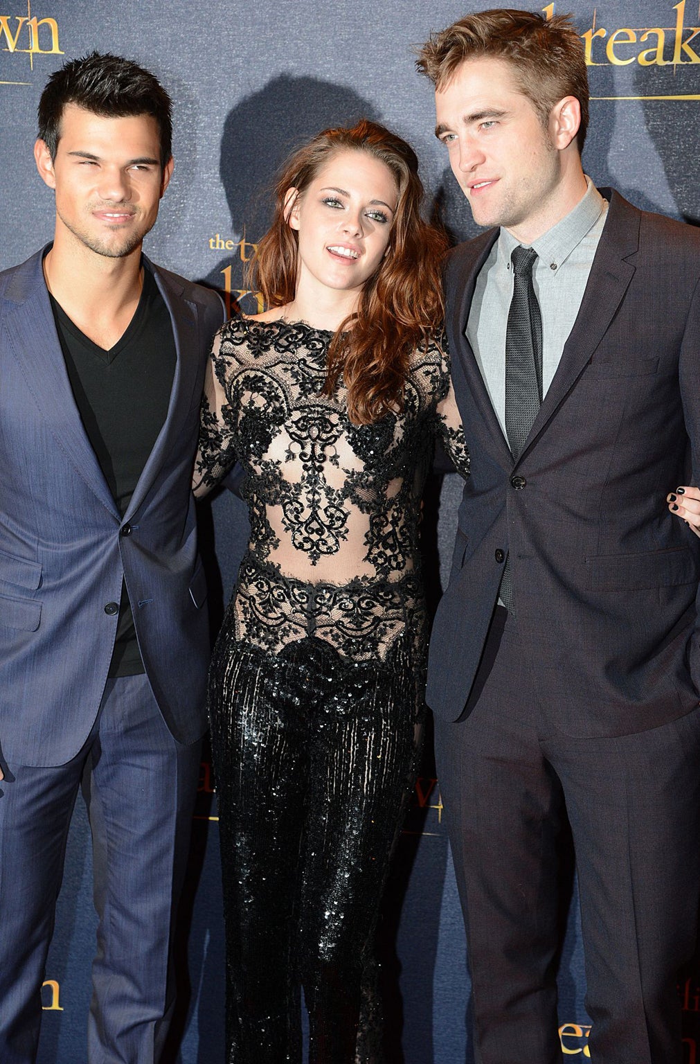 Taylor Lautner, Robert Pattinson and Kristen Stewart arm in arm at the 'Twilight Saga: Breaking Dawn Part 2' film premiere, London, Britain - 14 Nov 2012