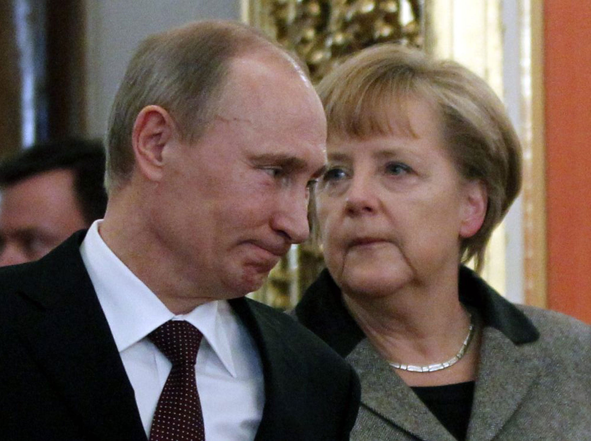 Vladimir Putin and Angela Merkel meet at the Kremlin