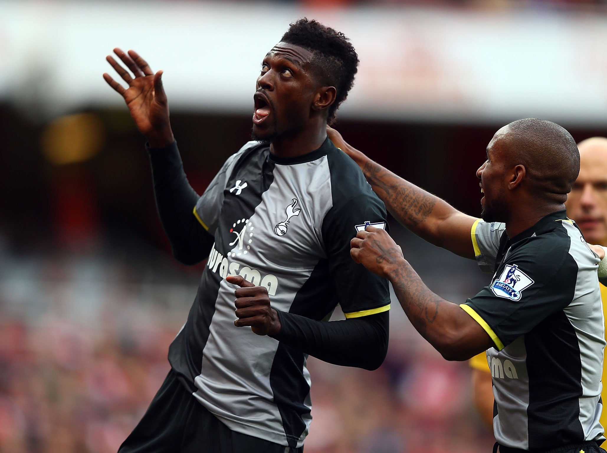 Emmanuel Adebayor celebrates his opener for Tottenham Hotspur against Arsenal