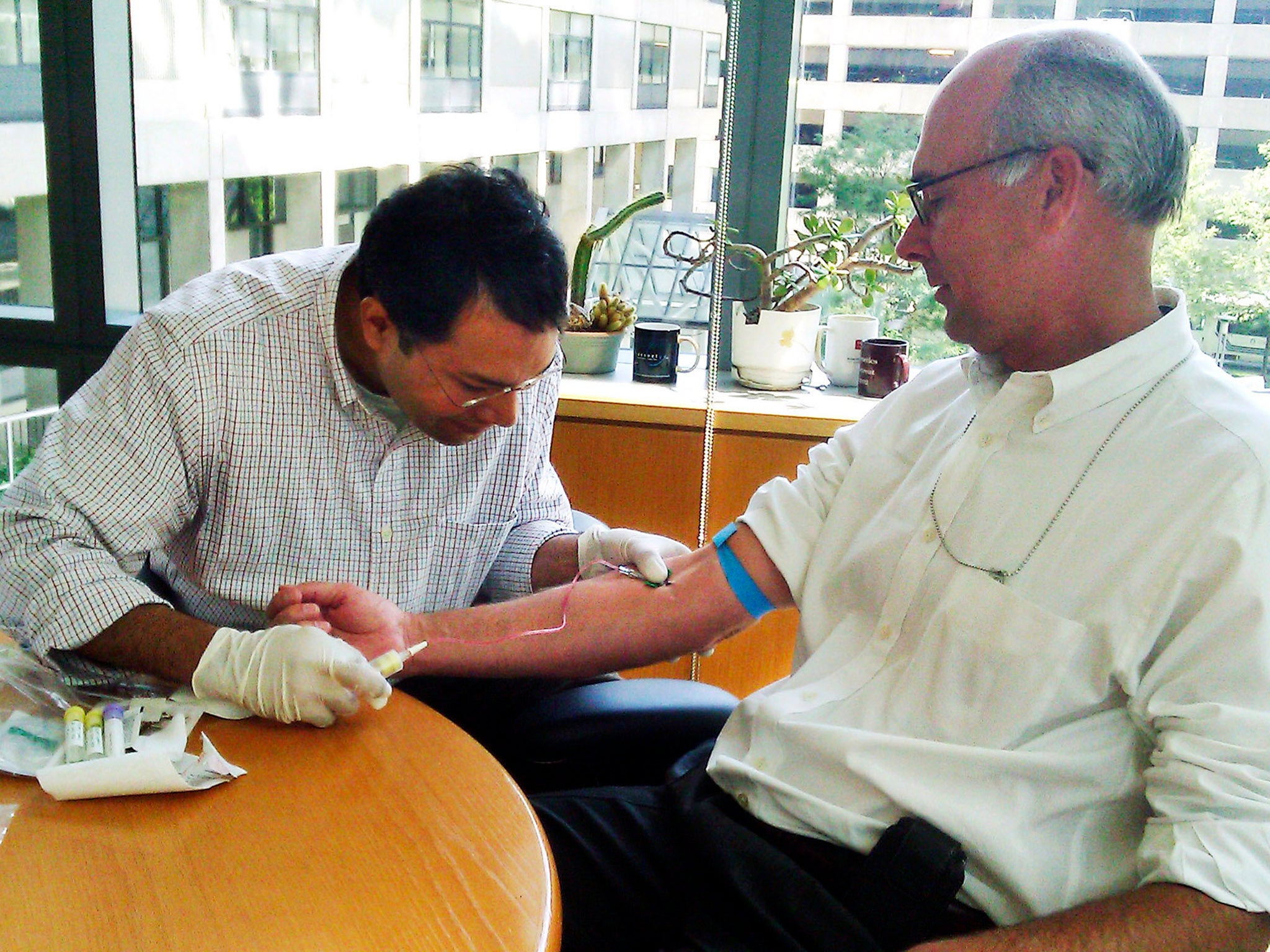 GENOME: Bloomberg News reporter John Lauerman (right) and Harvard Medical School geneticist Joseph Thakuria. After almost a year and $12,000, the genetic testing suggested possible future medical complications but fell short of offering definitive predict