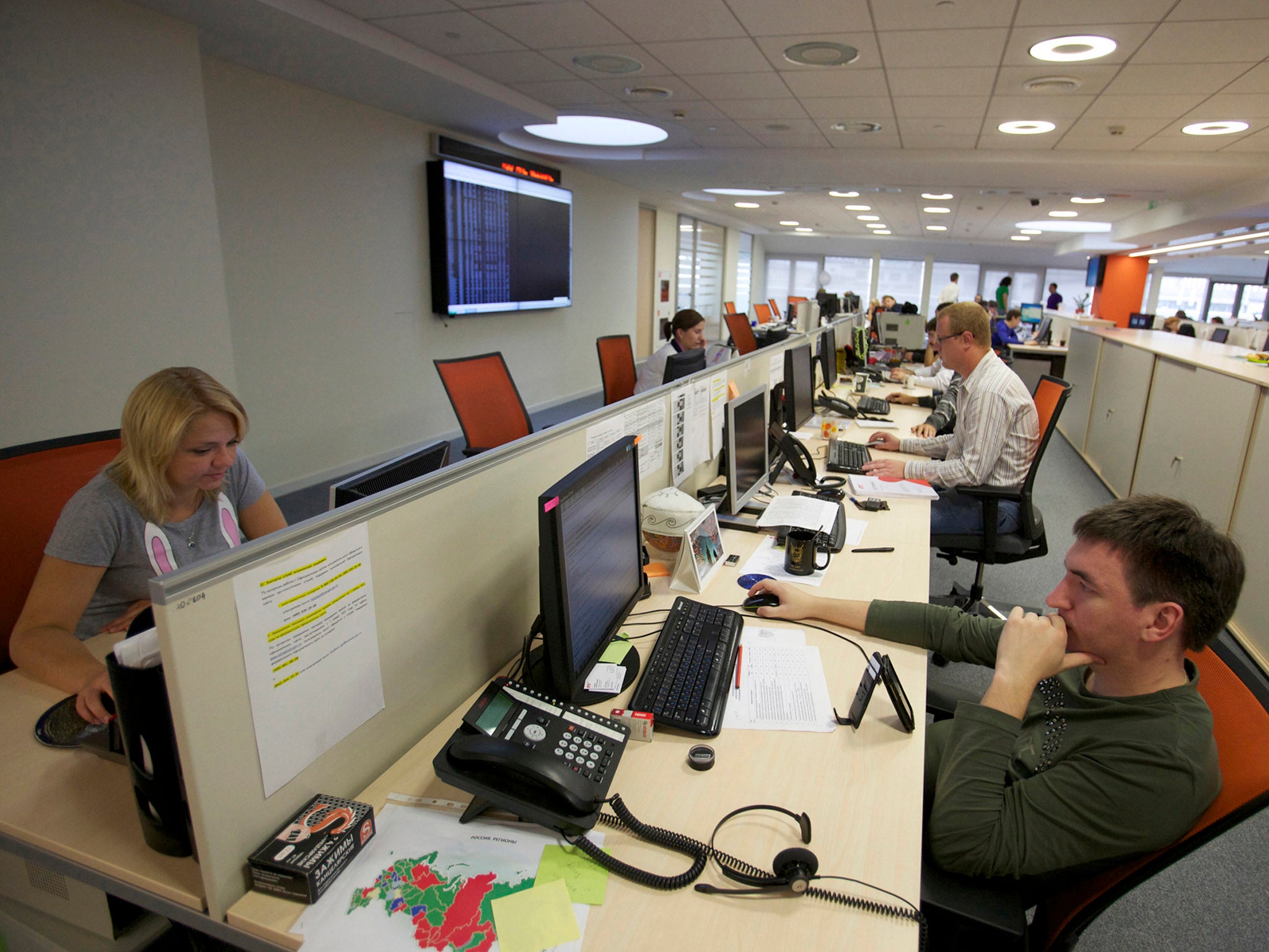 RUSSIA TIME: Employees work at computer screens at the RTS Stock Exchange in Moscow.