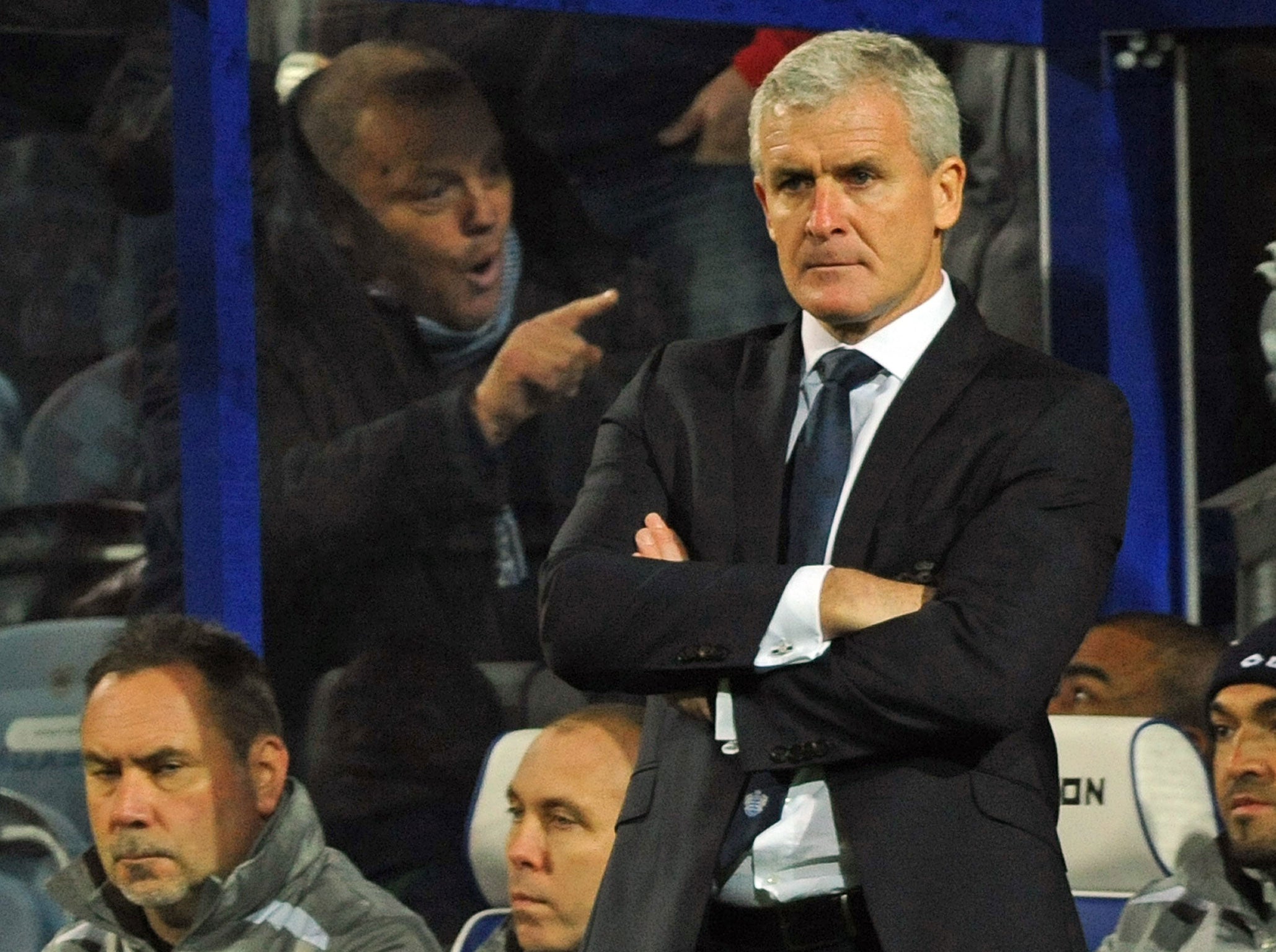 Mark Hughes gets a mouthful from a QPR supporter during Saturday's defeat to Southampton