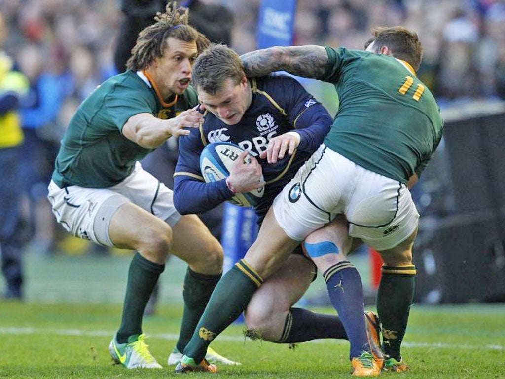 Stuart Hogg is met by a wall of Springbok defenders