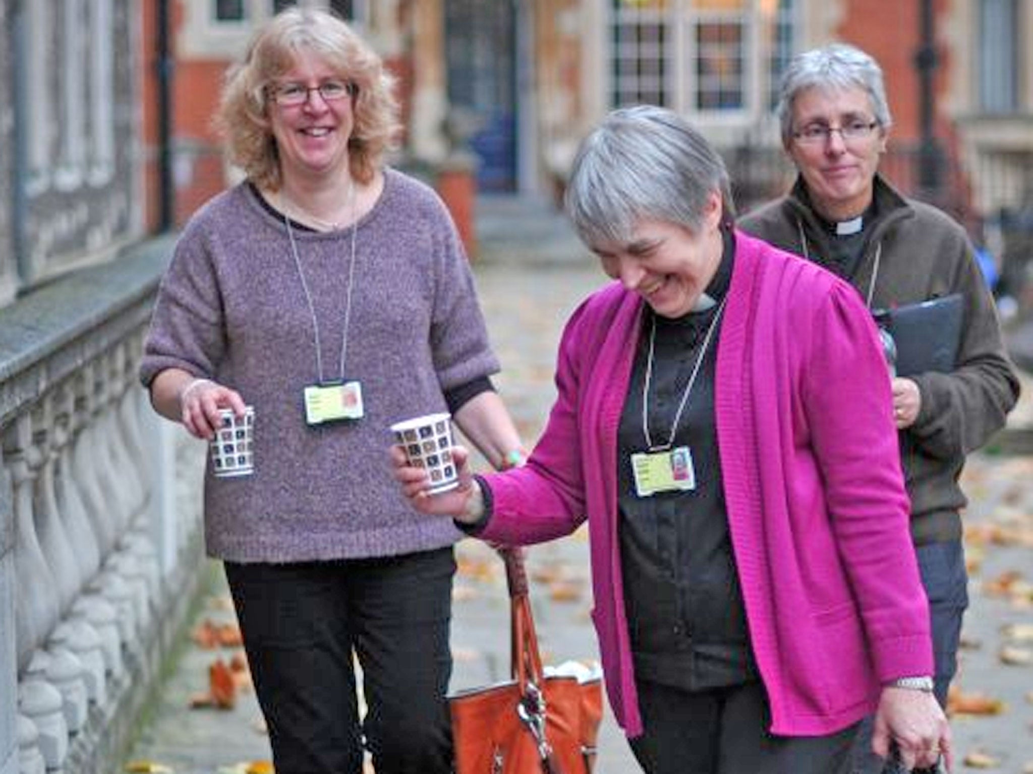 Female Church of England clergy walk into the venue of the three-day