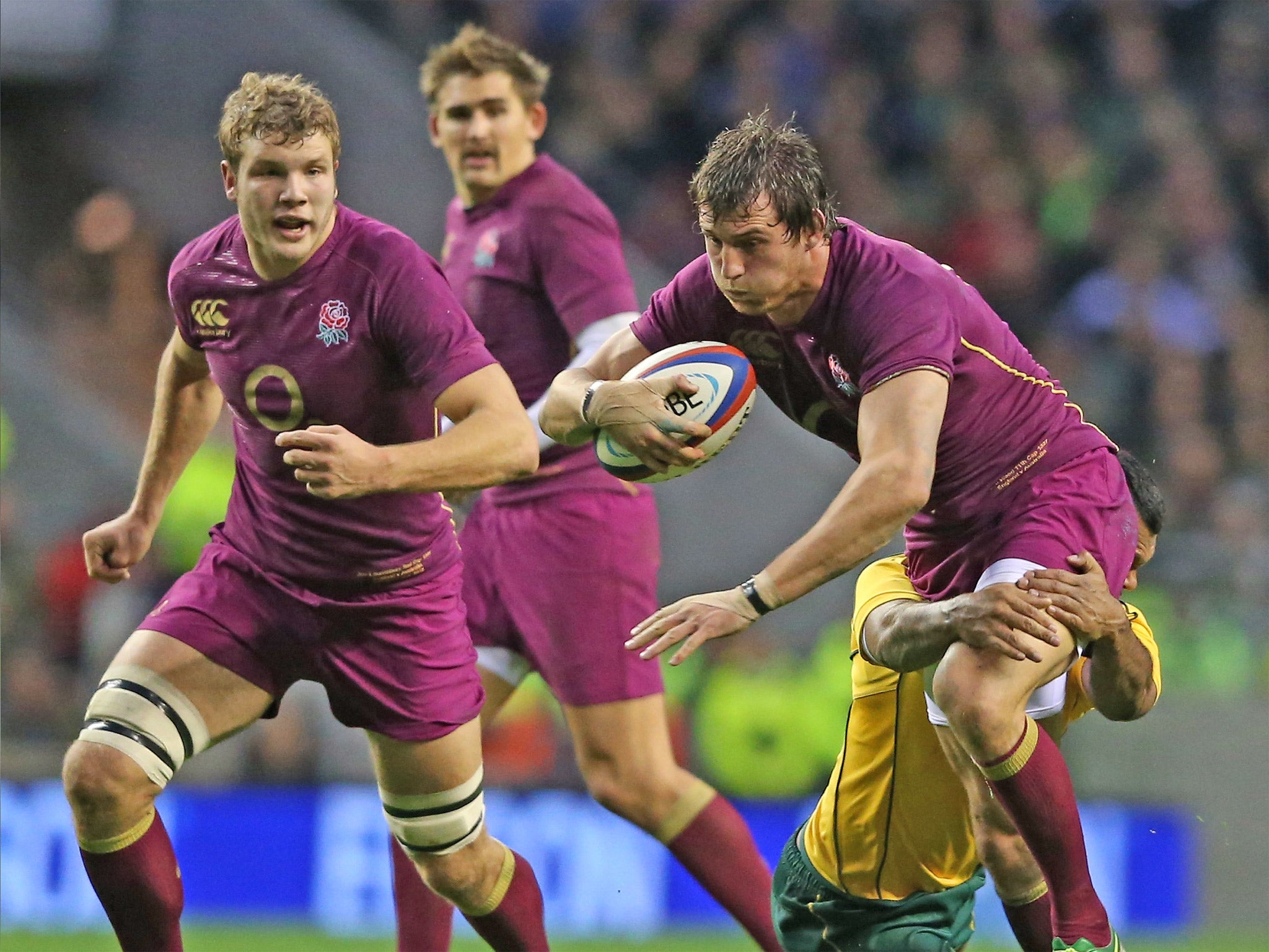 Tom Wood is tackled during England’s defeat to Australia