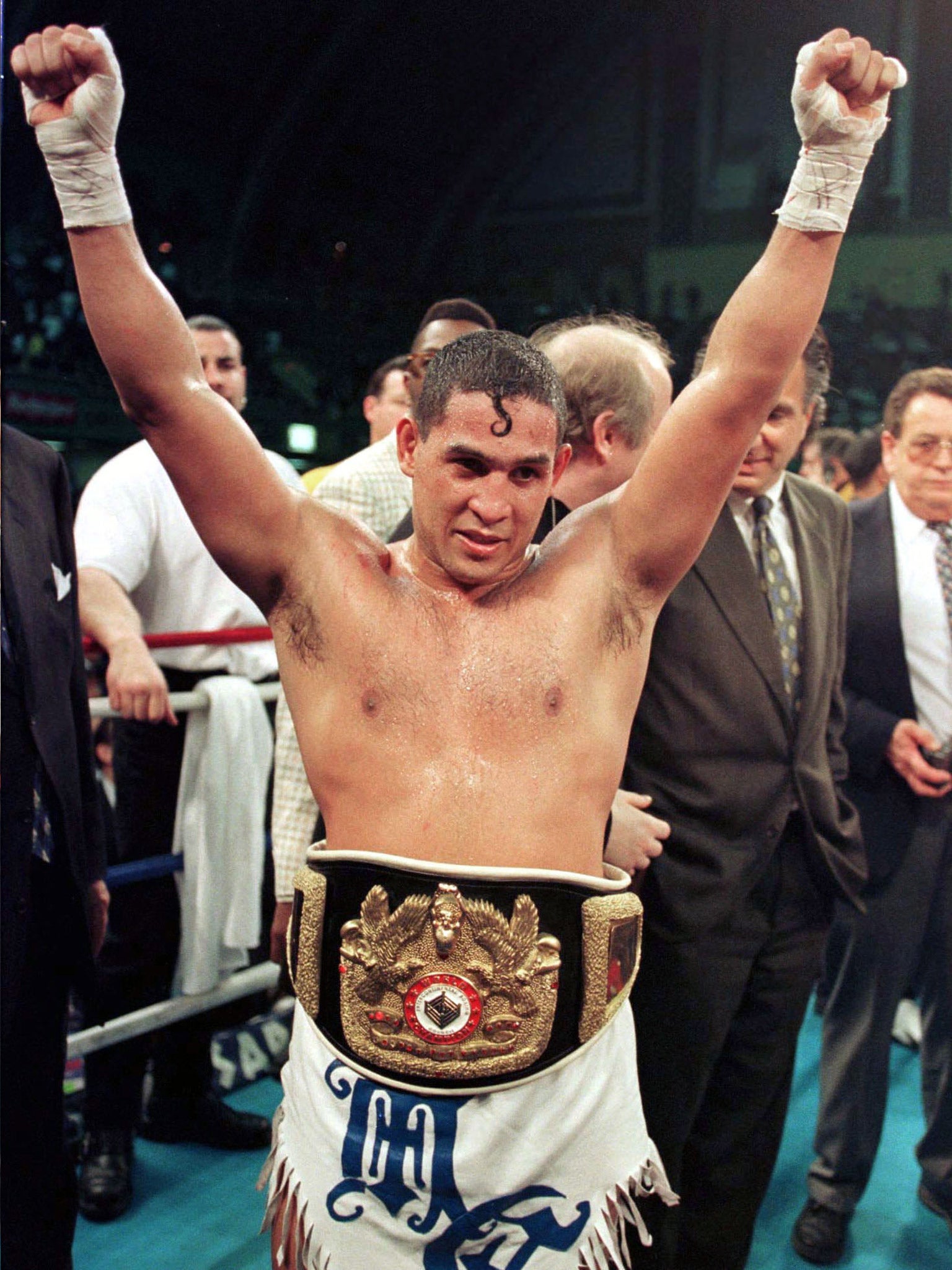 Camacho enjoying his win against Sugar Ray Leonard in 1997