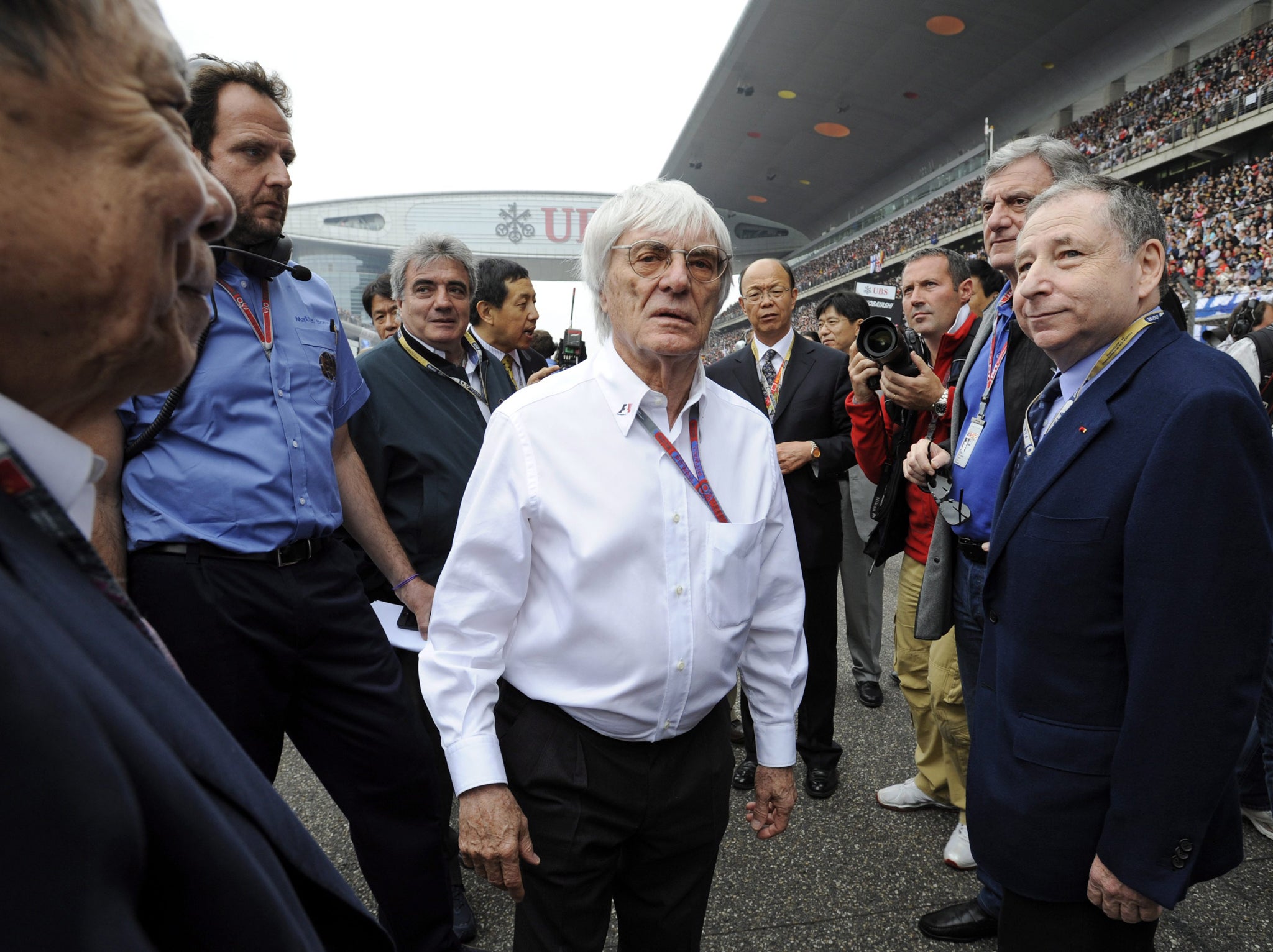 Bernie Ecclestone, centre, says he has no plans to retire