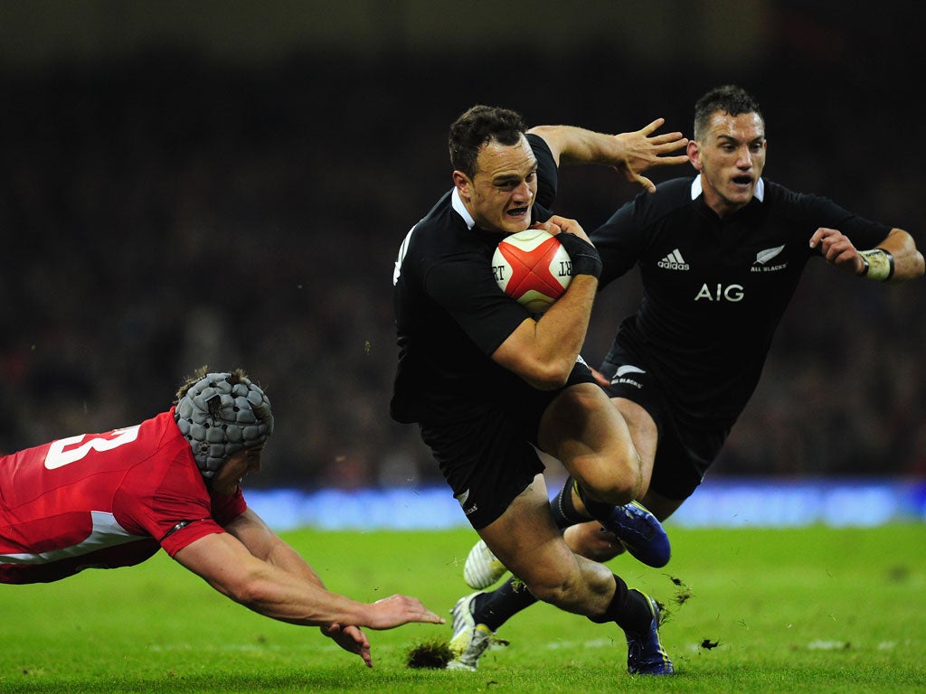 New Zealand All Blacks fullback Israel Dagg runs at the Wales defence