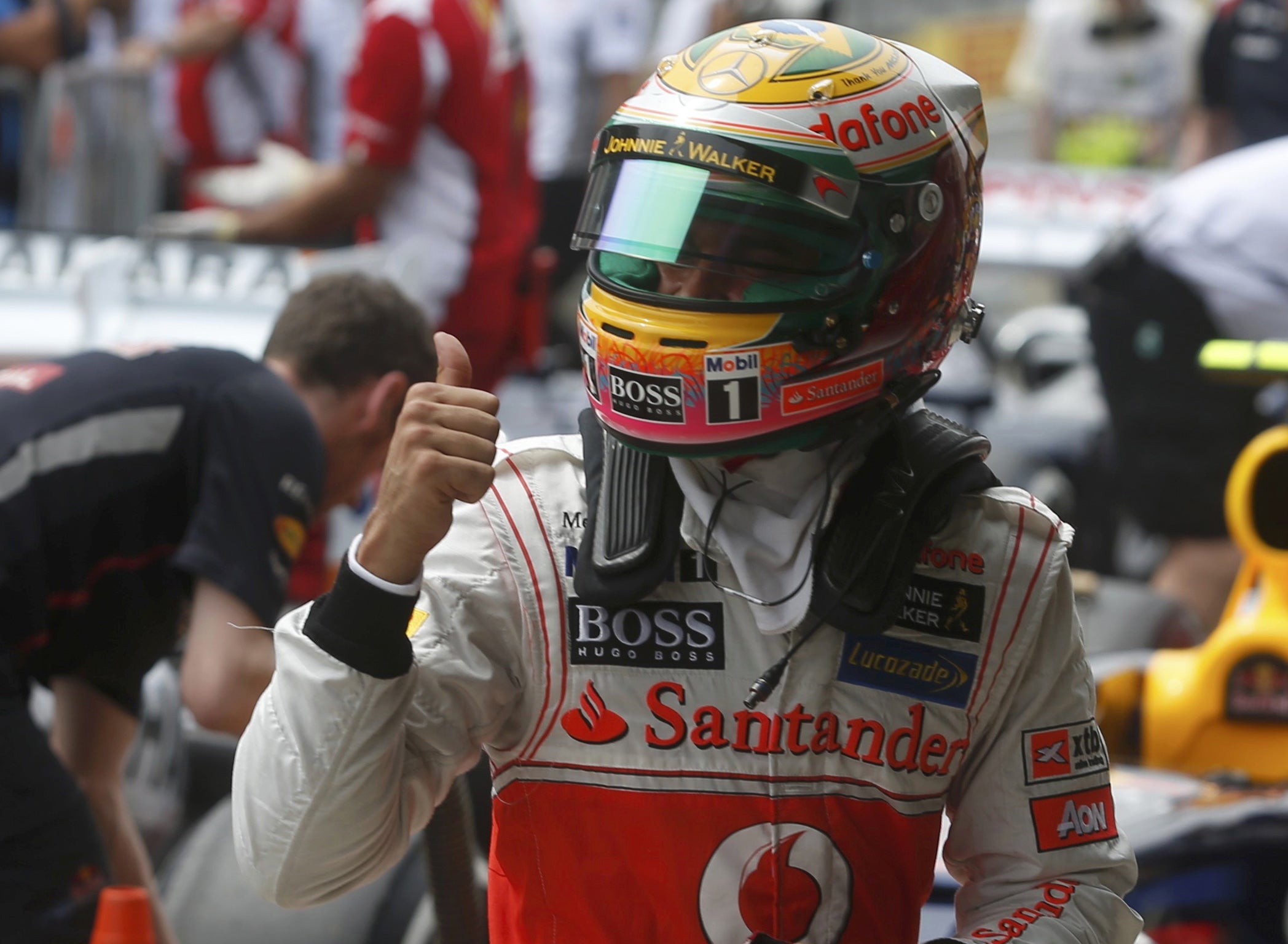 Thumbs up: Lewis Hamilton celebrates his pole position in Säo Paulo