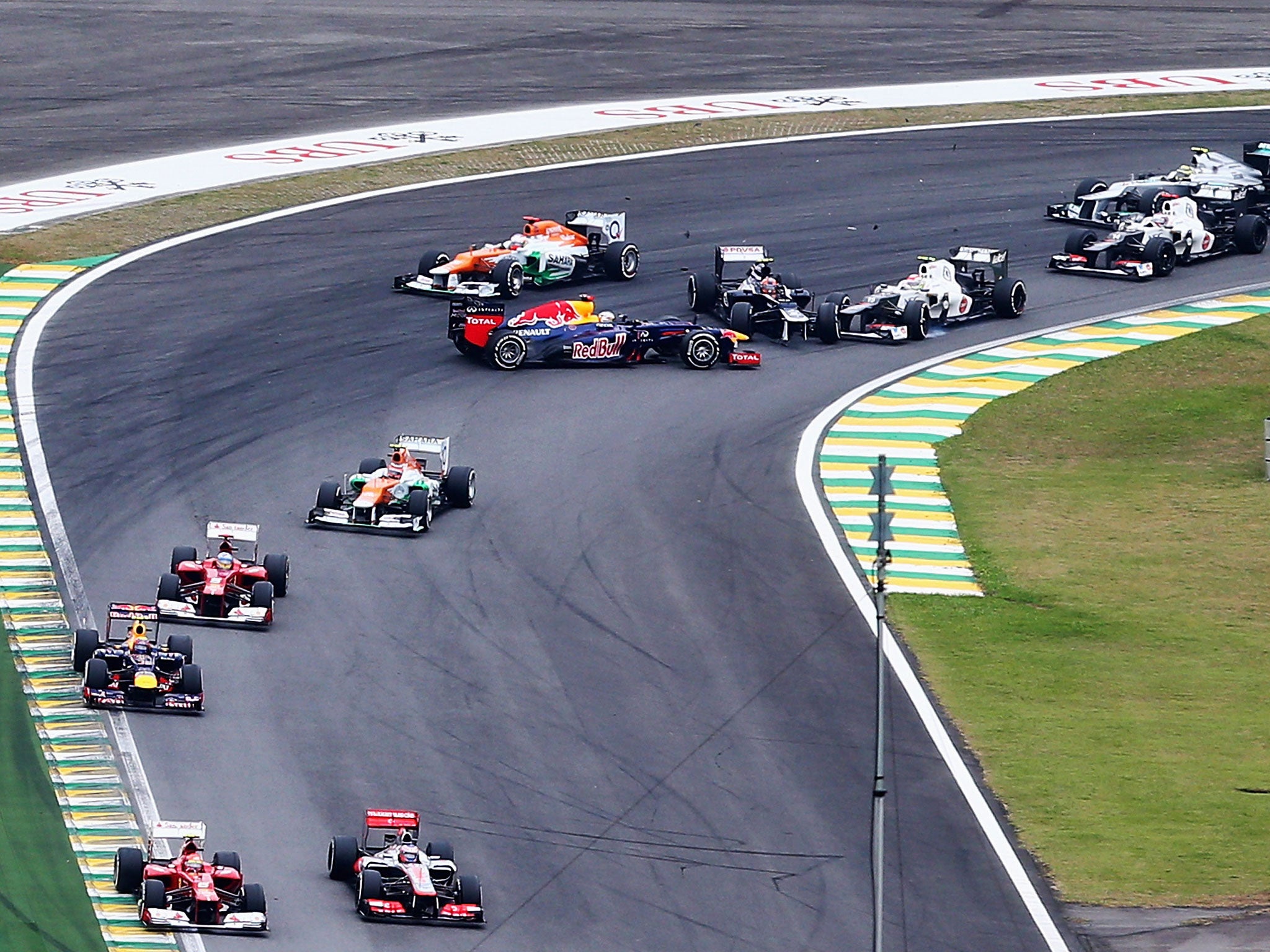 Sebastian Vettel of Red Bull Racing spins after being involved in an incident with Bruno Senna of Williams