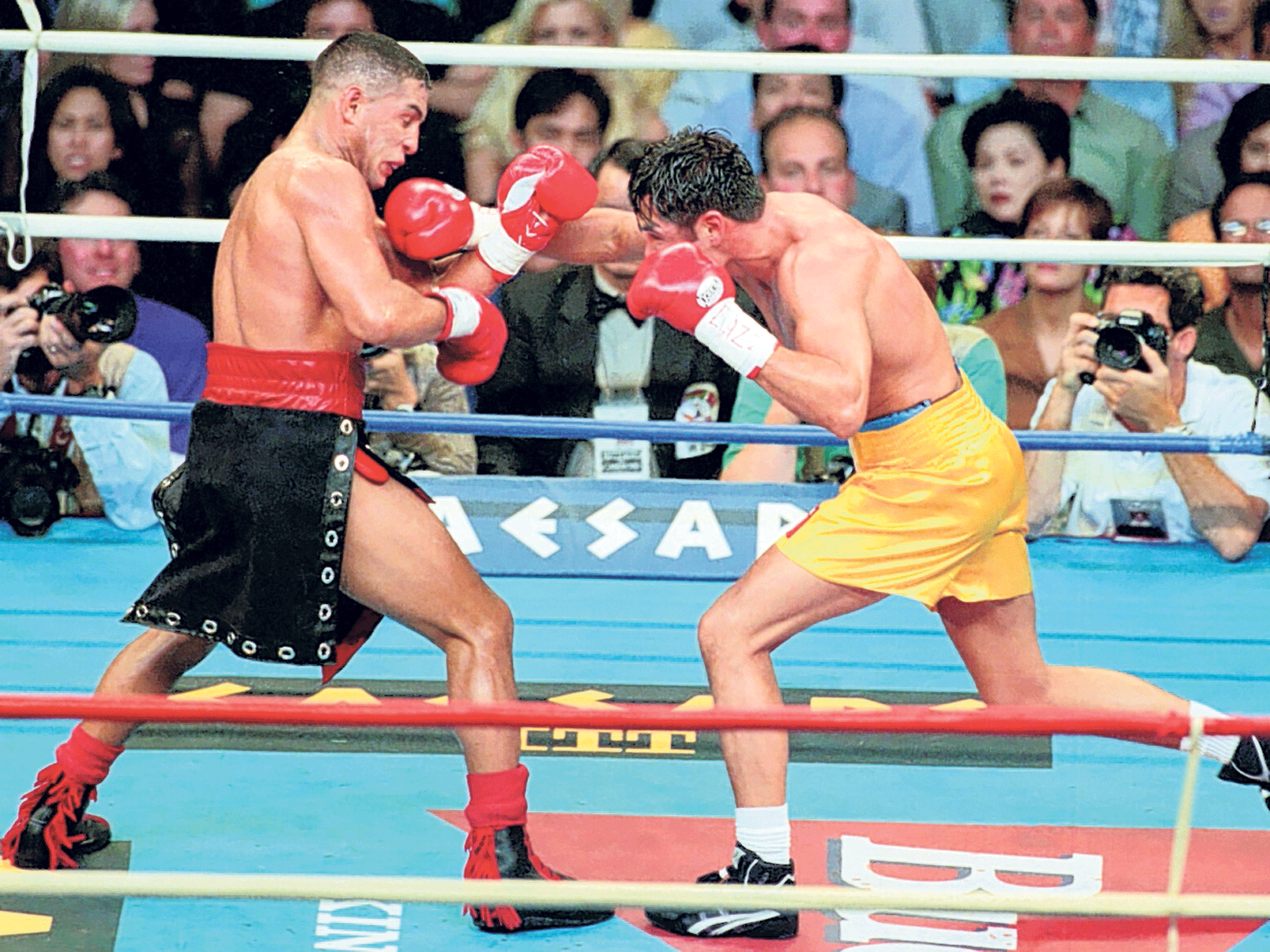 Camacho, above left, fights Oscar De La Hoya in 1997