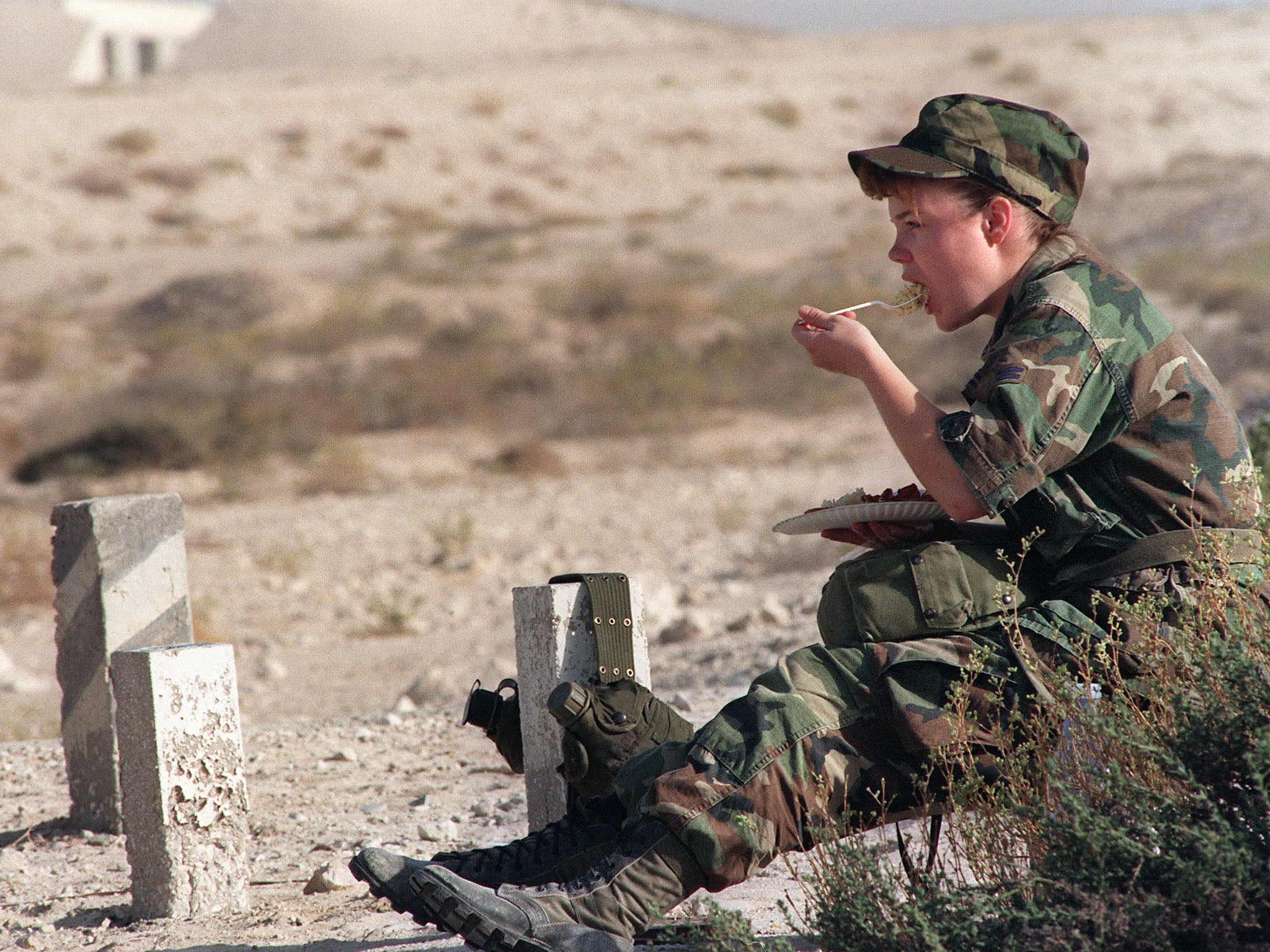 A female US soldier eats breakfast while on tour in Afghanistan