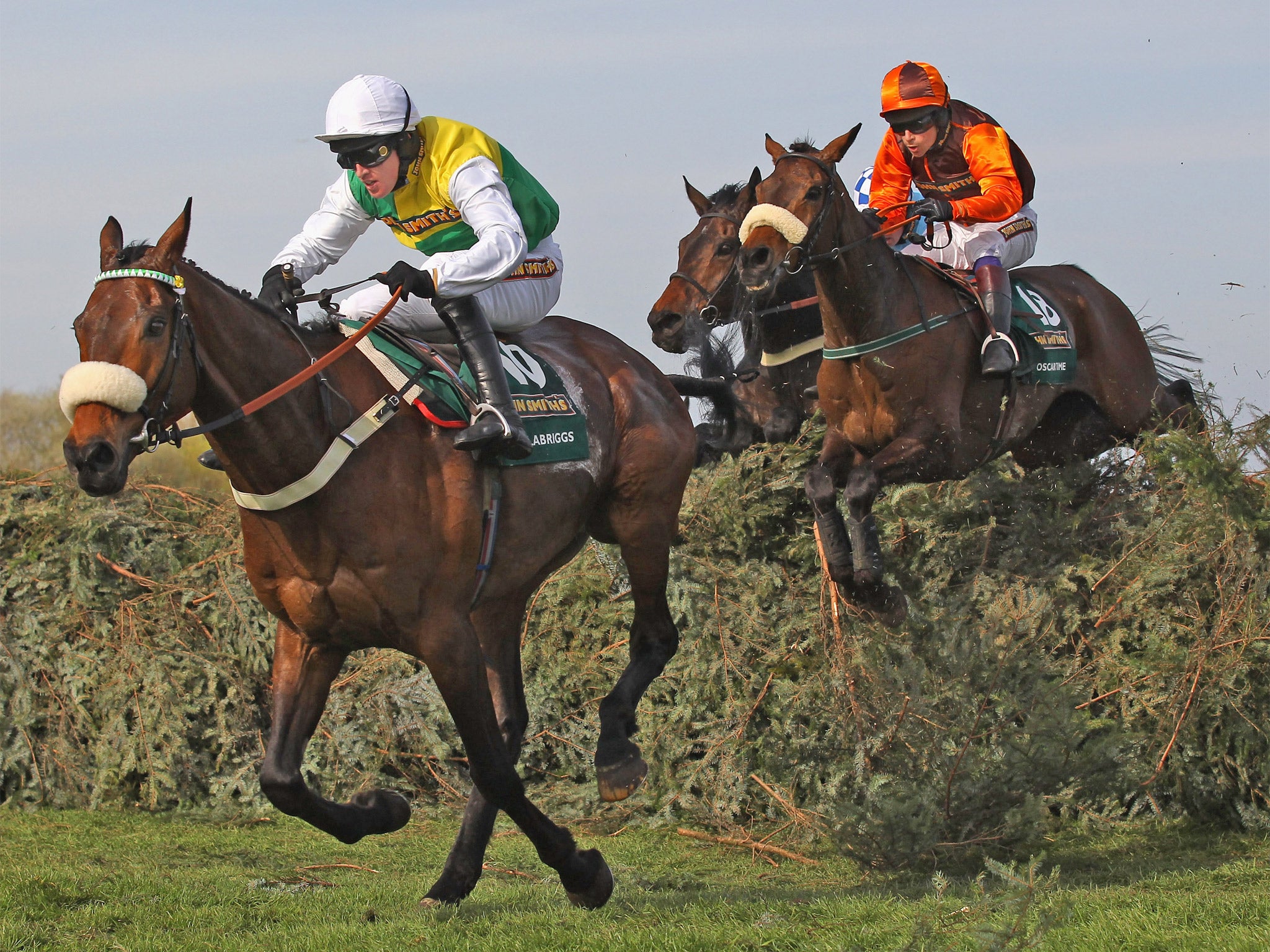 Aintree 2011: winner Ballabriggs and Jason Maguire clear the last from Sam Waley-Cohen’s Oscar Time