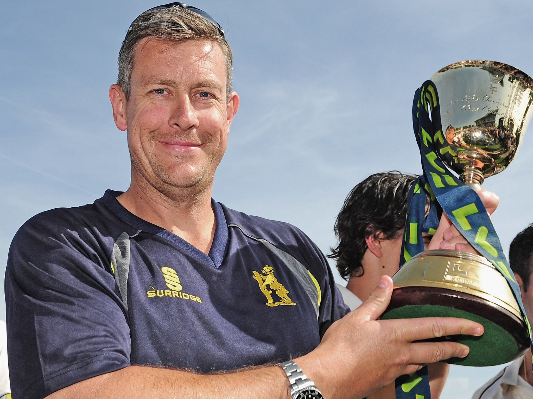 Ashley Giles holds aloft the County Championship trophy