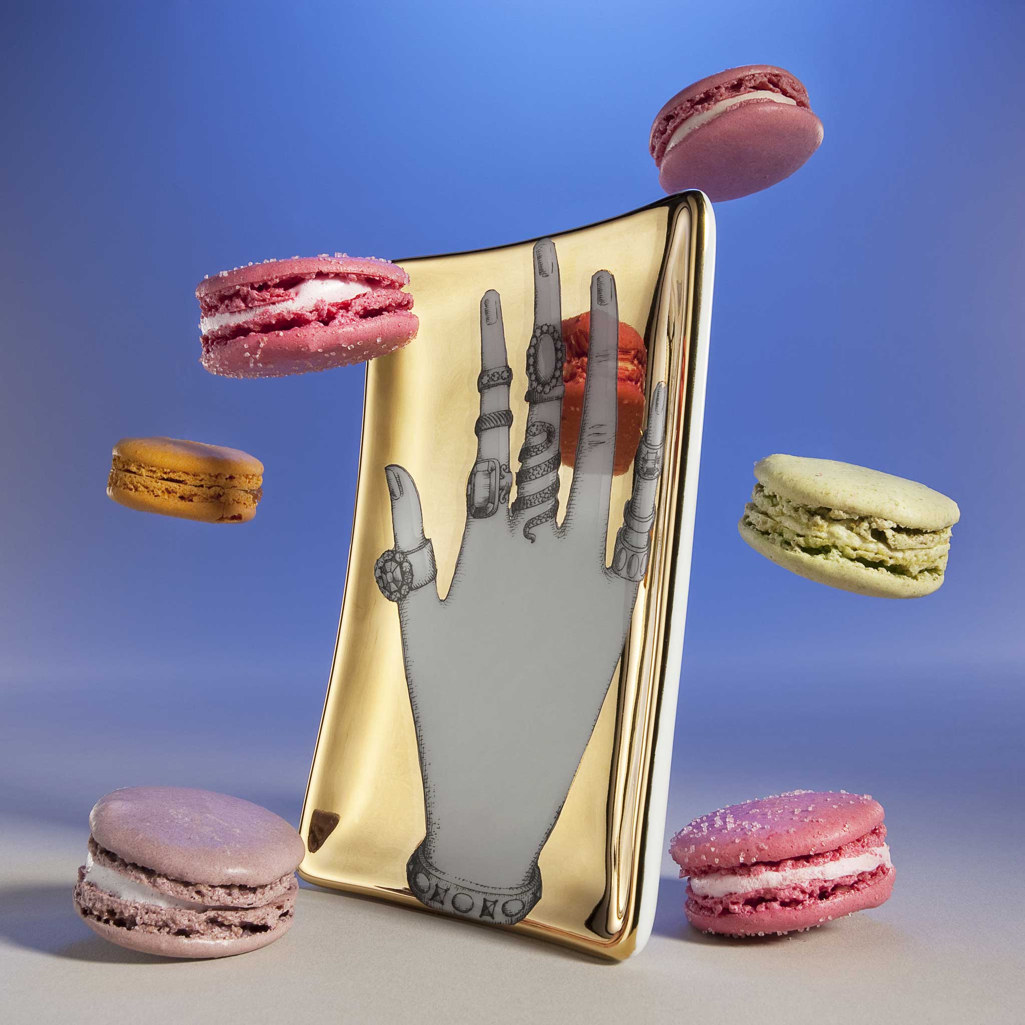 Hand tray by Fornasetti, £175, Liberty; macarons, from a selection, Laduree