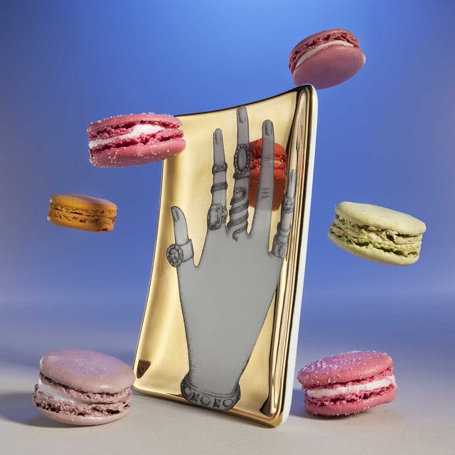 Hand tray by Fornasetti, £175, Liberty; macarons, from a selection, Laduree